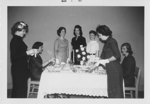 4.31.3: Students with formal table setting, possibly in the Home Economics House