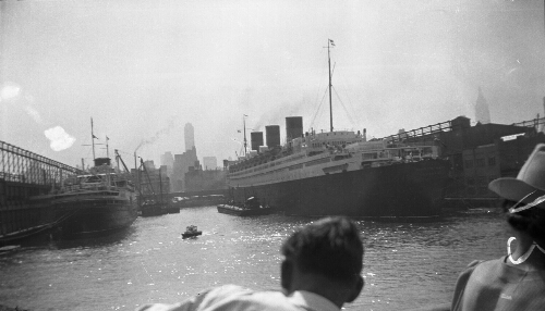 7.1.4: "The Queen Mary as we saw her from our harbor trip." - from the back of the photo