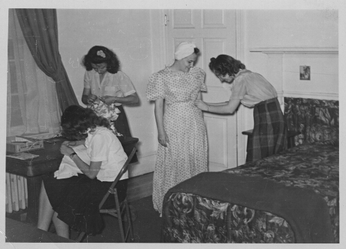 7.11.4: Home economics students working on a dress