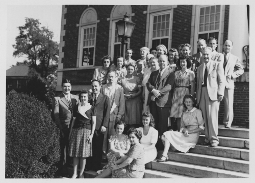 2.29.6: Dr. Peters, Dr. Moffett, and others in front of McConnell Library
