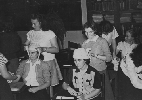7.19.3: Students learning First Aid during World War II