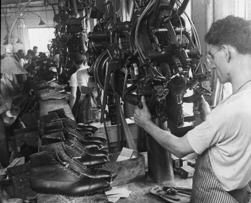 Lasting Machine Shaping Shoes in Shoe Factory, Lynn, Mass.