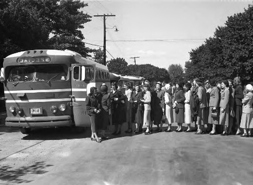 1.17.7: Students boarding bus, 1930s.