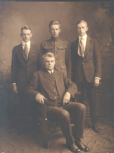 Radford College President John Preston McConnell (seated) poses with his sons: Robert Lucas McConnell, Carl Hiram McConnell, and John Paul McConnell