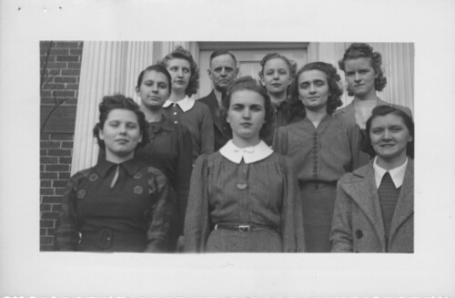 Debaters, 1939. Front Row: Victoria Hines Burton, Charlotte Crews, Lucille Horned.  Second Row: Jewell Peters, Eileen Yeatts, Dr. W. S. Long, Bili Shelton, Evelyn Williams, Anna Clark
