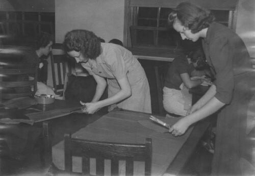 1.1.3: Students sewing in class