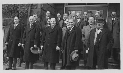 3.4.1: Dr. David Peters, President of Radford College, with other men