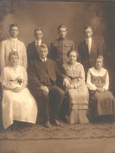 Radford College President John Preston McConnell and his wife, Clara Lucas McConnell, pose with their family.  Front row: June McConnell Graybeal, John P. McConnell, Clara L. McConnell, and Annie Ginsey McConnell. Back row: Henry Clay Grabeal, Robert Lucas McConnell, Carl Hiram McConnell, and John Paul McConnell.