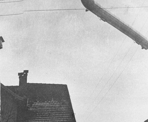 Zeppelin Flying Over a German Town