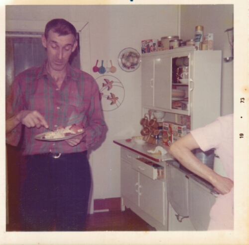 Harley Cordle eating breakfast in the kitchen of his house in Raven, VA. 1973